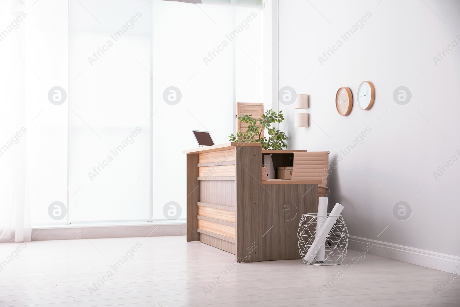 Photo of Hotel lobby interior with wooden reception desk