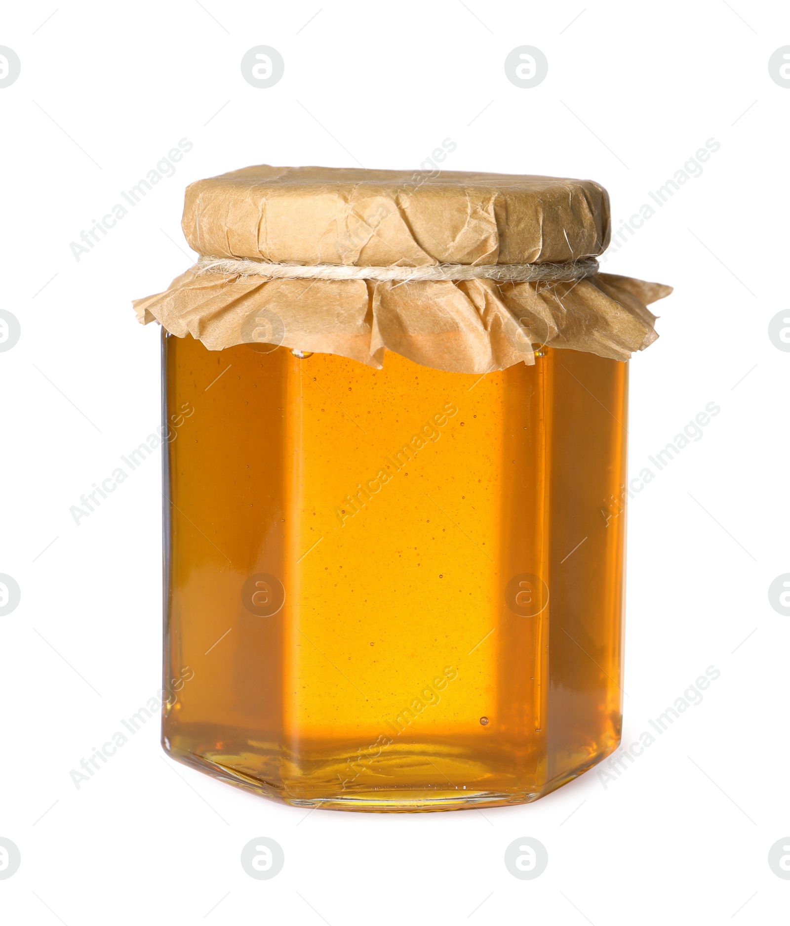 Photo of Tasty natural honey in glass jar isolated on white