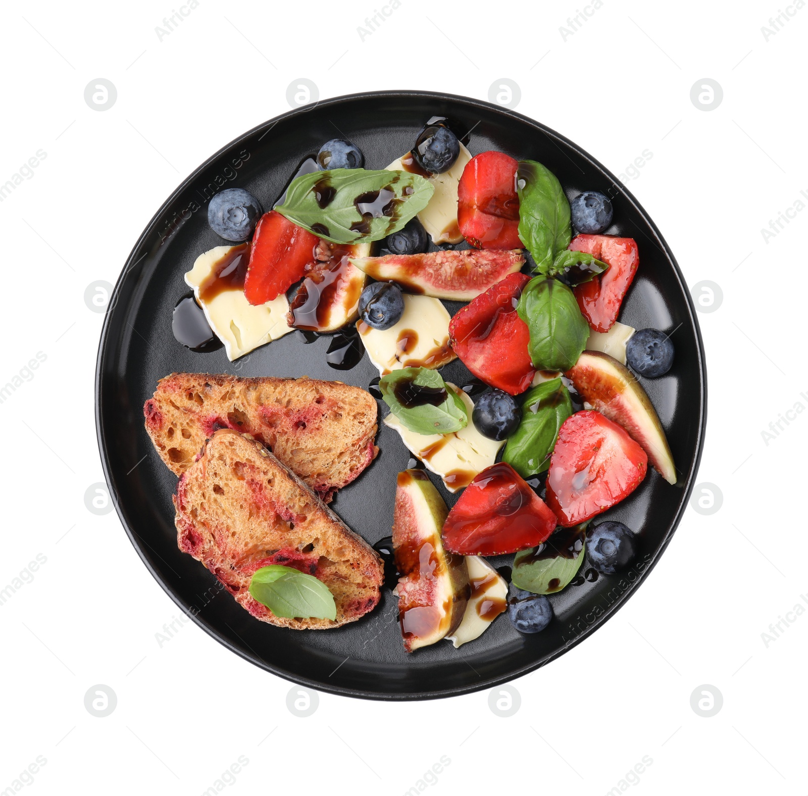 Photo of Plate of delicious salad with brie cheese, berries and balsamic vinegar isolated on white, top view