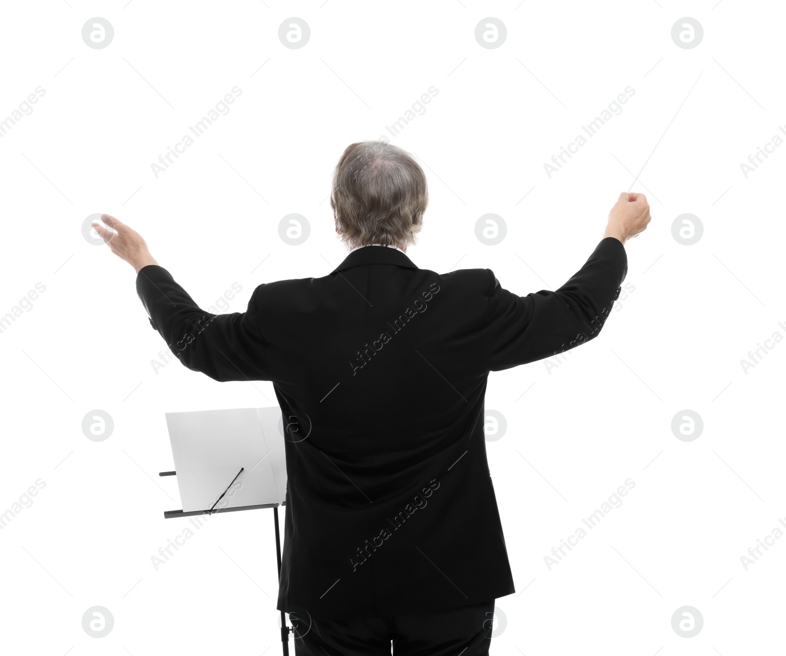 Photo of Professional conductor with baton and note stand on white background, back view