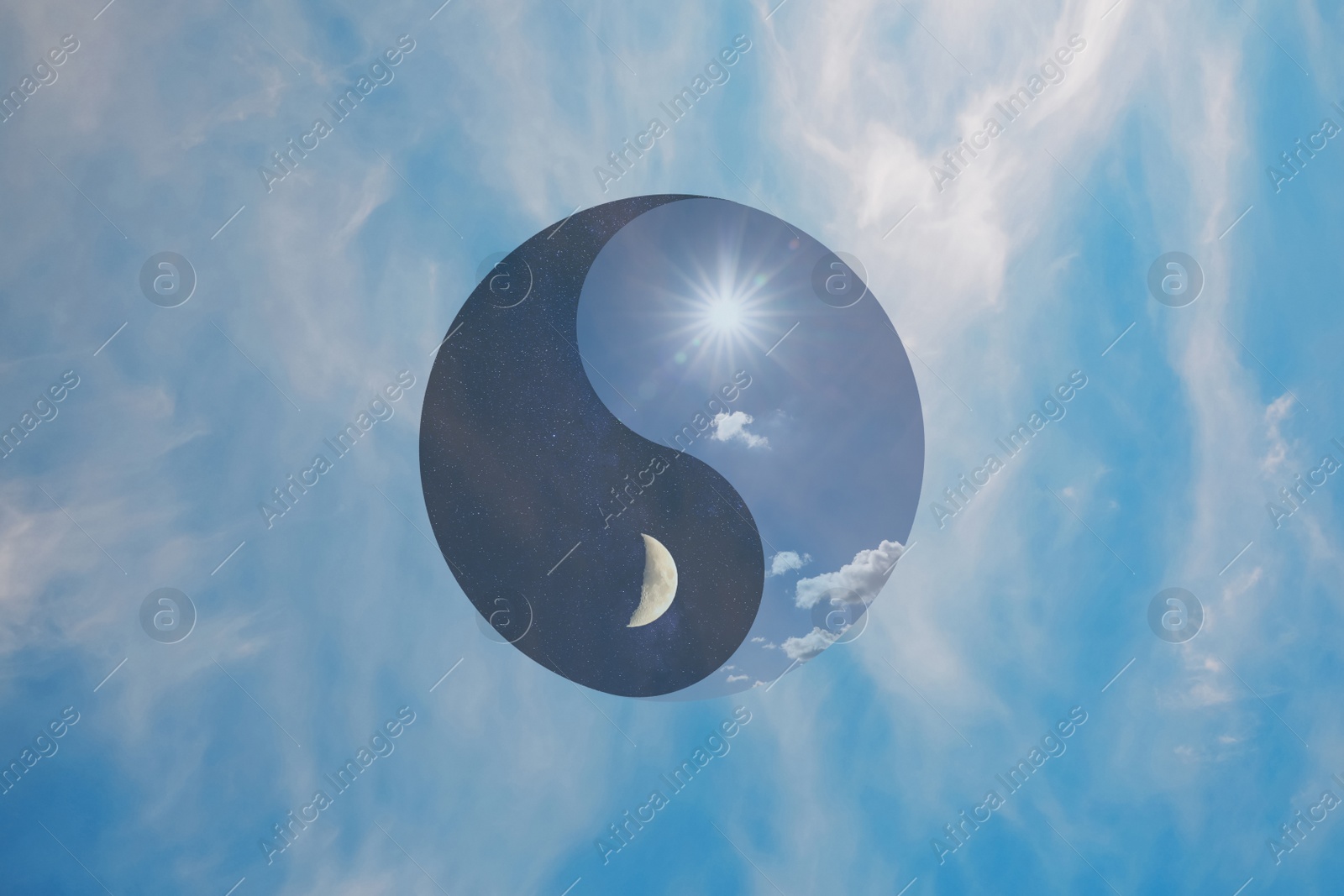 Image of Ying Yang symbol against blue sky. Feng Shui philosophy