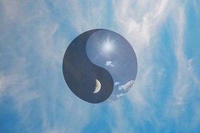 Image of Ying Yang symbol against blue sky. Feng Shui philosophy