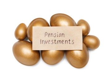 Photo of Golden eggs and card with phrase Pension Investments on white background, top view