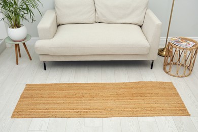 Stylish rug on floor in living room