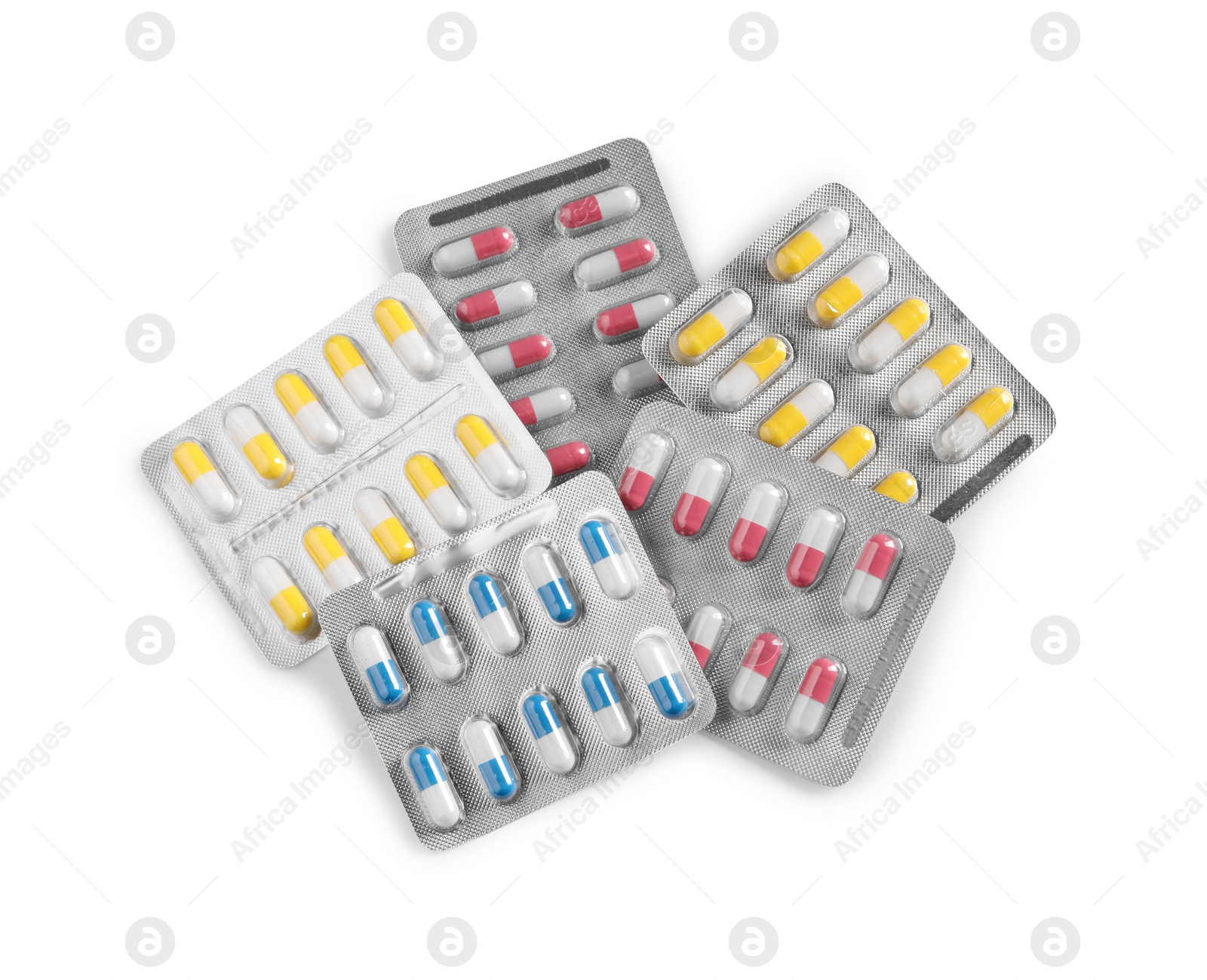 Photo of Many blisters with different pills on white background, top view