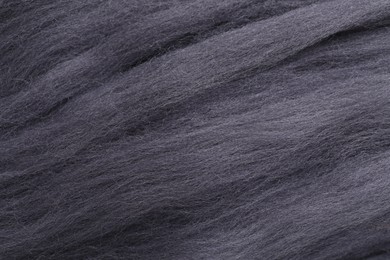 Photo of Grey felting wool as background, closeup view