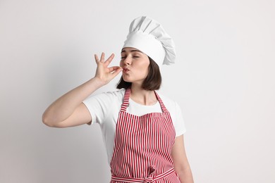 Photo of Portrait of confectioner on light grey background