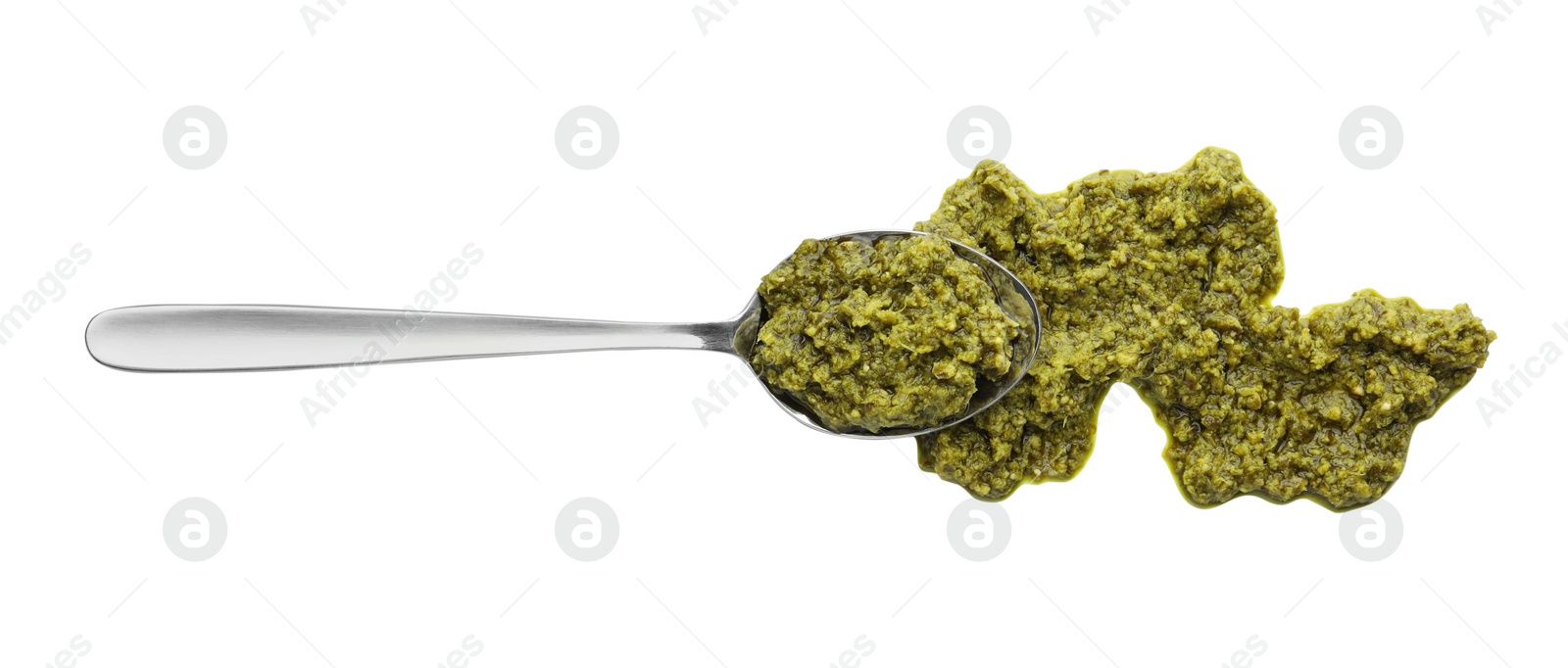Photo of Tasty pesto sauce and spoon isolated on white, top view