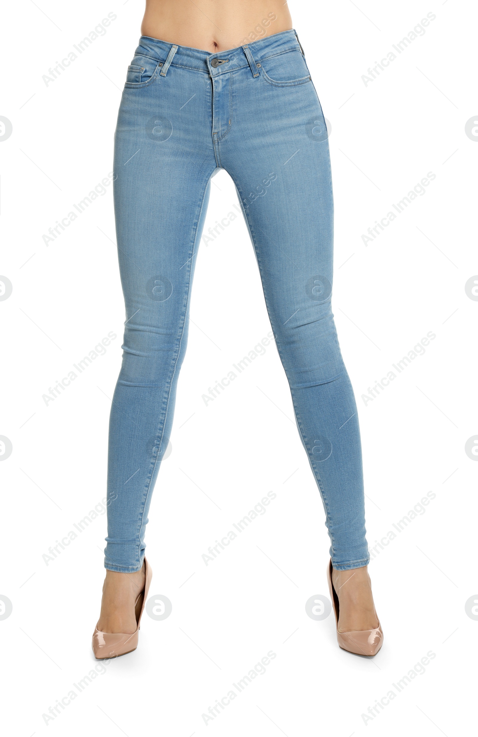 Photo of Woman wearing stylish light blue jeans and high heels shoes on white background, closeup