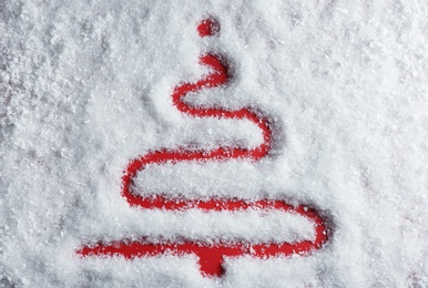 Christmas tree silhouette in snow on color background, top view
