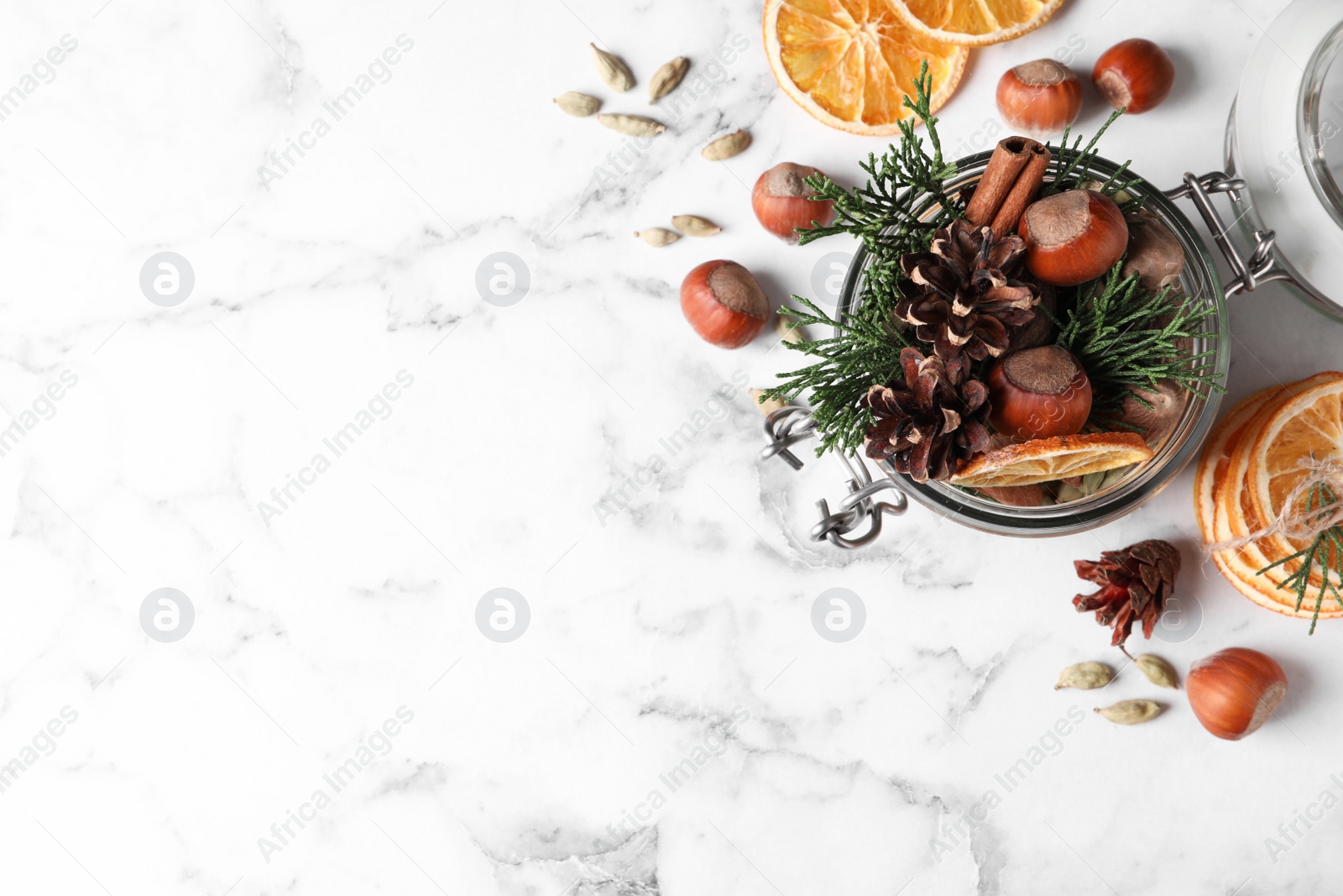 Photo of Aroma potpourri with different spices on white marble table, flat lay. Space for text