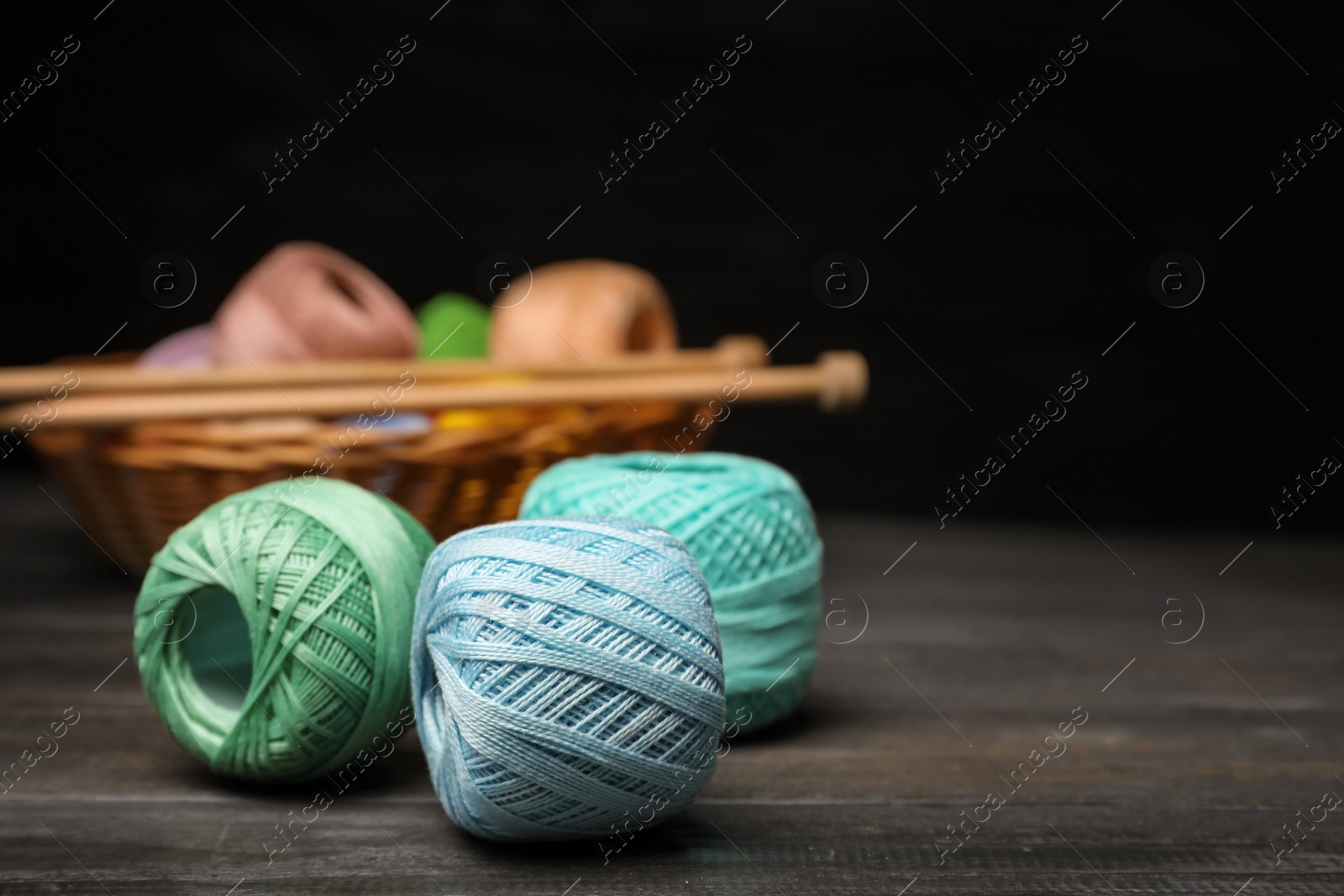 Photo of Color threads on wooden table