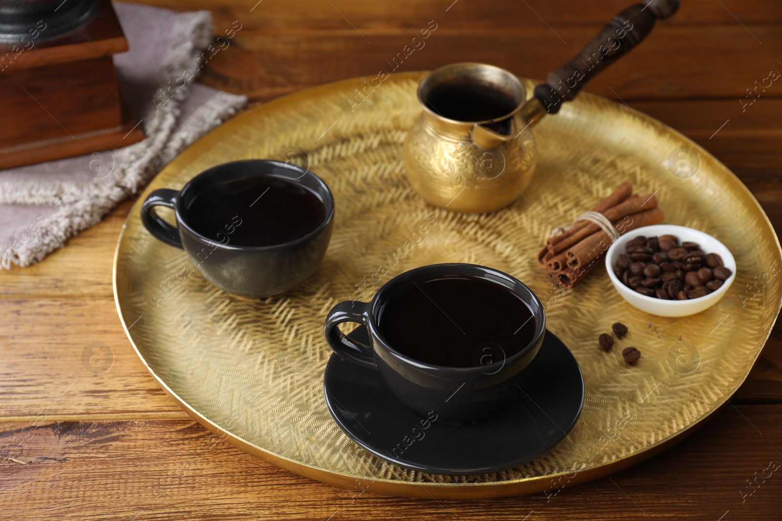 Photo of Turkish coffee. Freshly brewed beverage served on wooden table