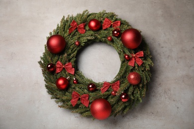Beautiful Christmas wreath on grey background, top view