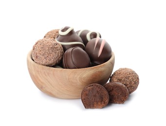 Photo of Bowl with many different delicious chocolate truffles on white background