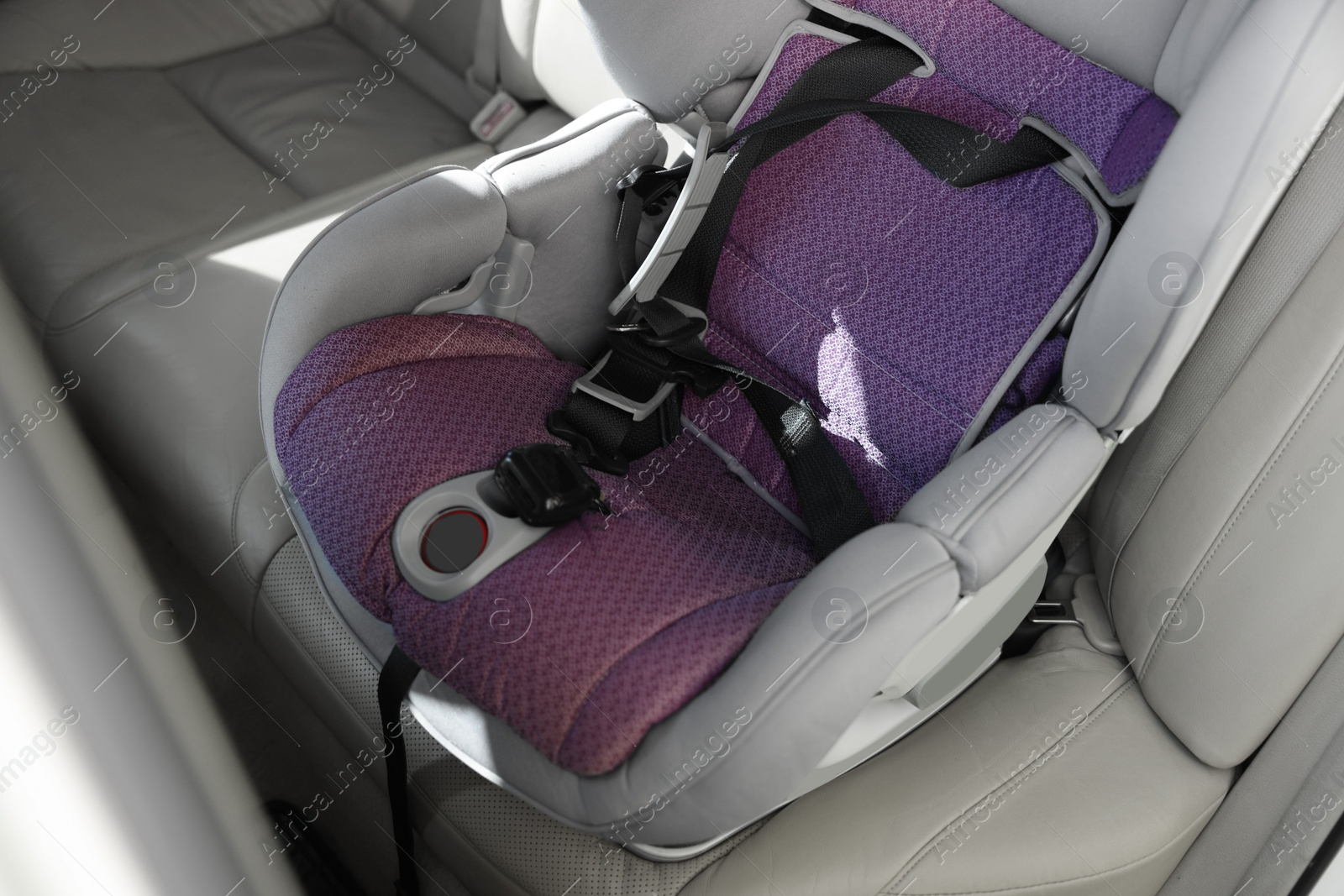 Photo of Empty modern child safety seat inside car