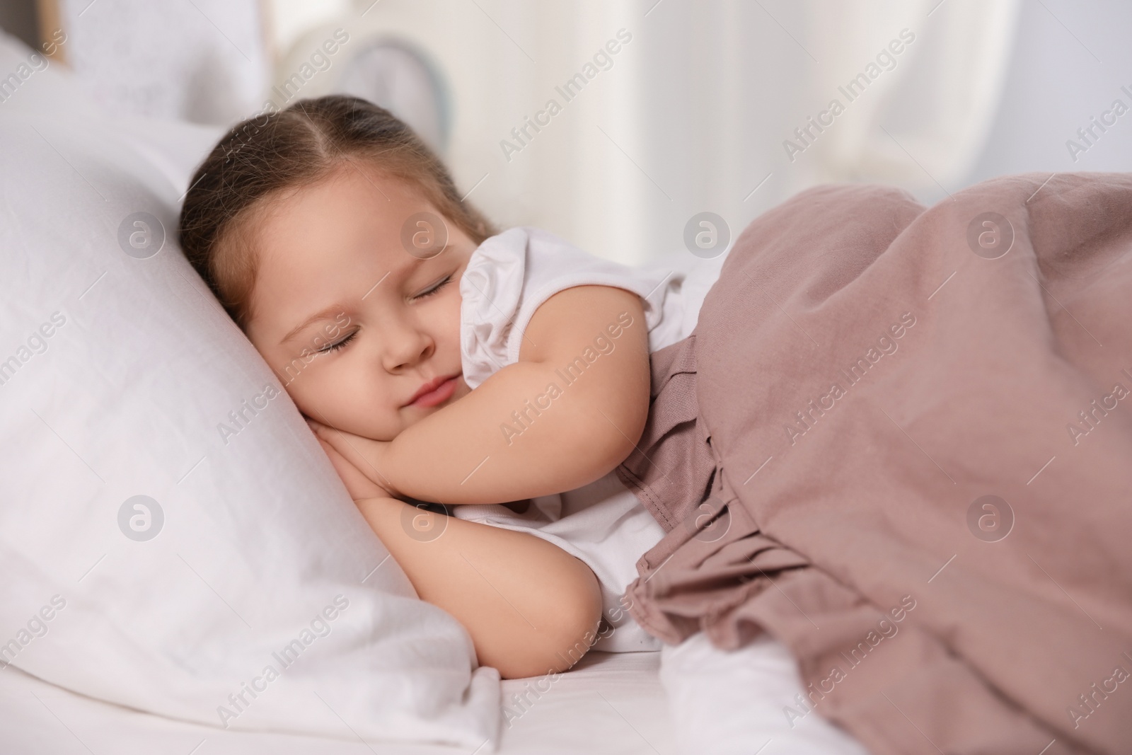 Photo of Cute little girl sleeping at home. Bedtime schedule