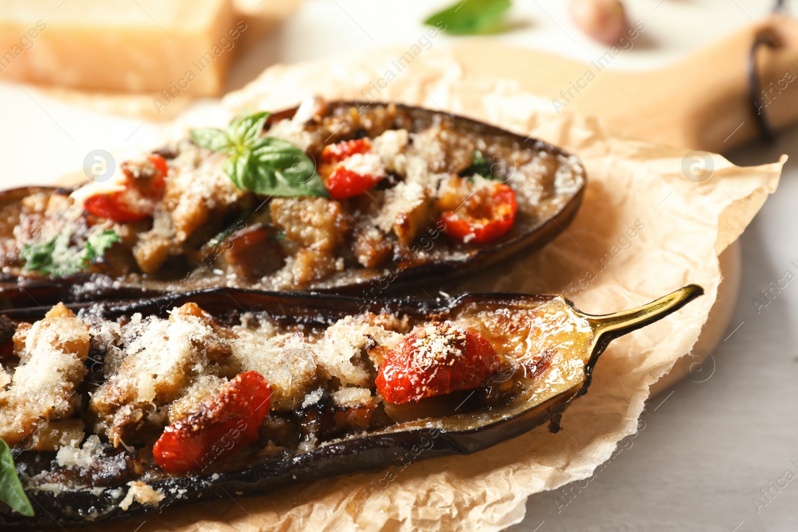 Photo of Tasty stuffed eggplants on light table, closeup