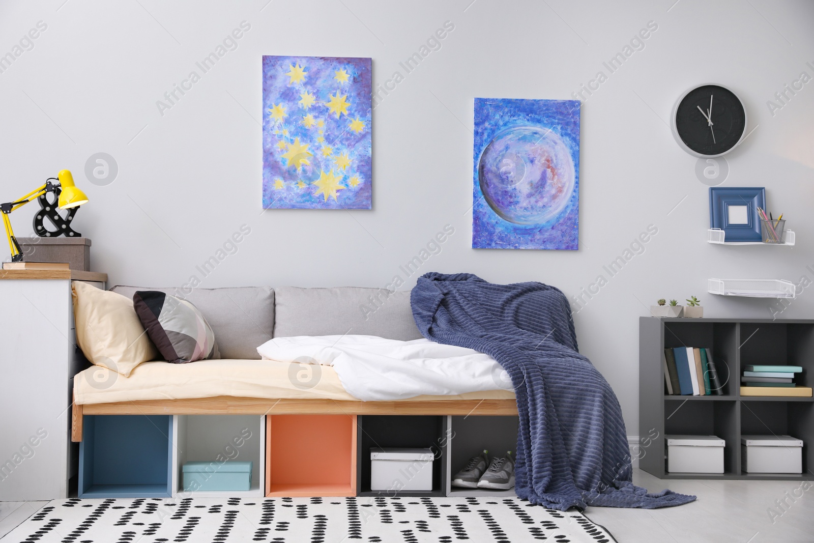 Photo of Modern teenager's room interior with comfortable bed and stylish design elements