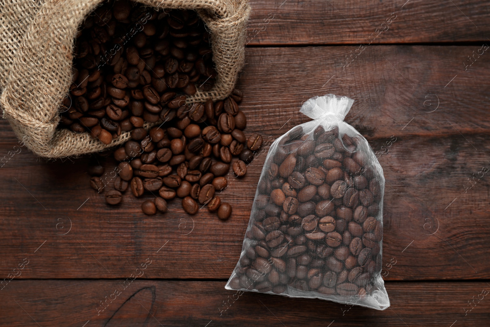 Photo of Scented sachet with coffee beans on wooden table, flat lay