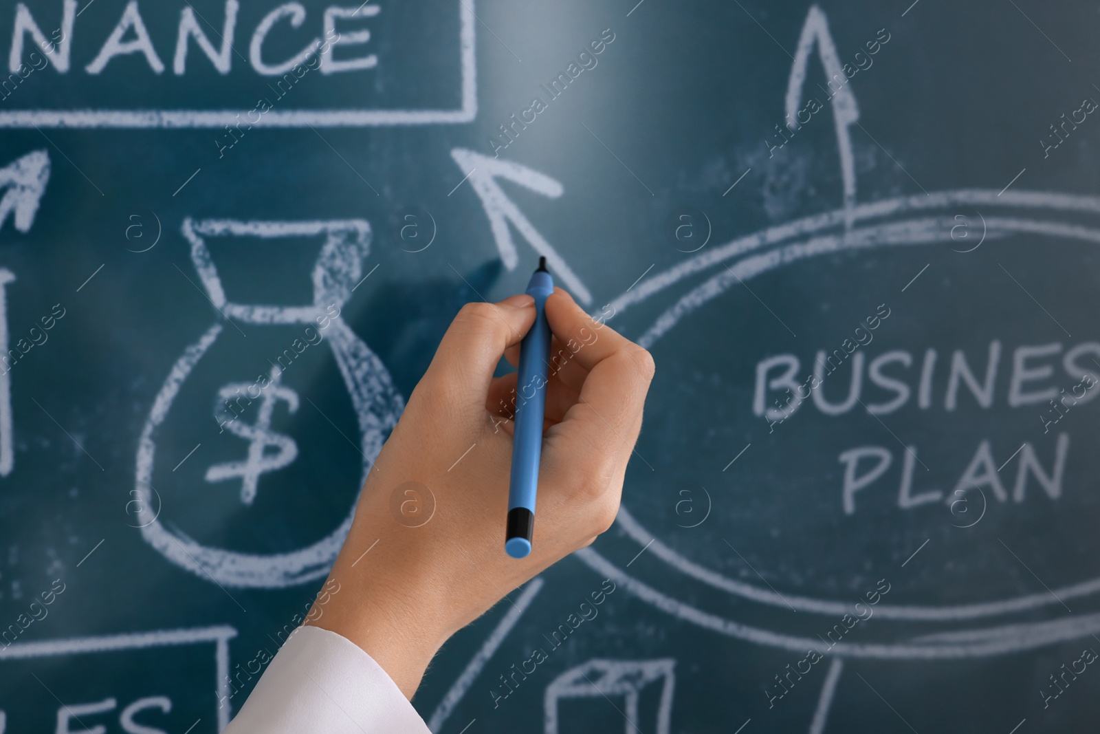 Photo of Business trainer with pen using interactive board, closeup