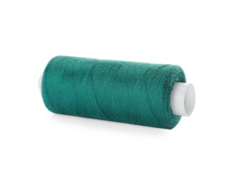 Spool of green sewing thread isolated on white