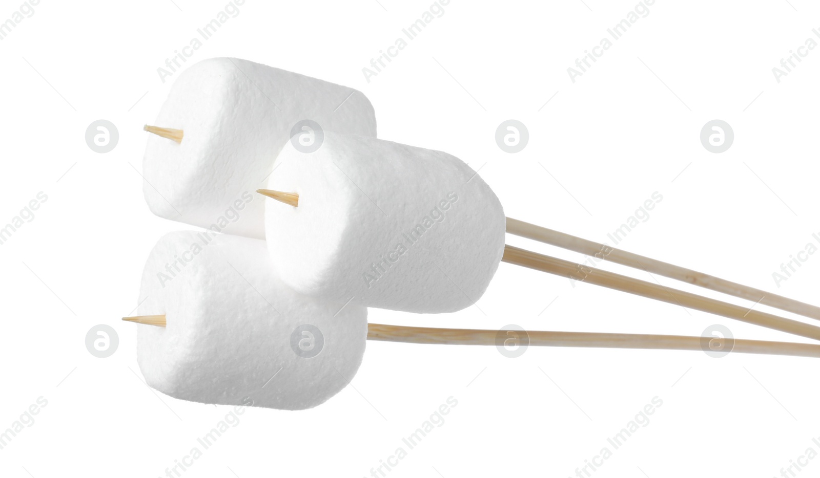 Photo of Sticks with delicious puffy marshmallows on white background