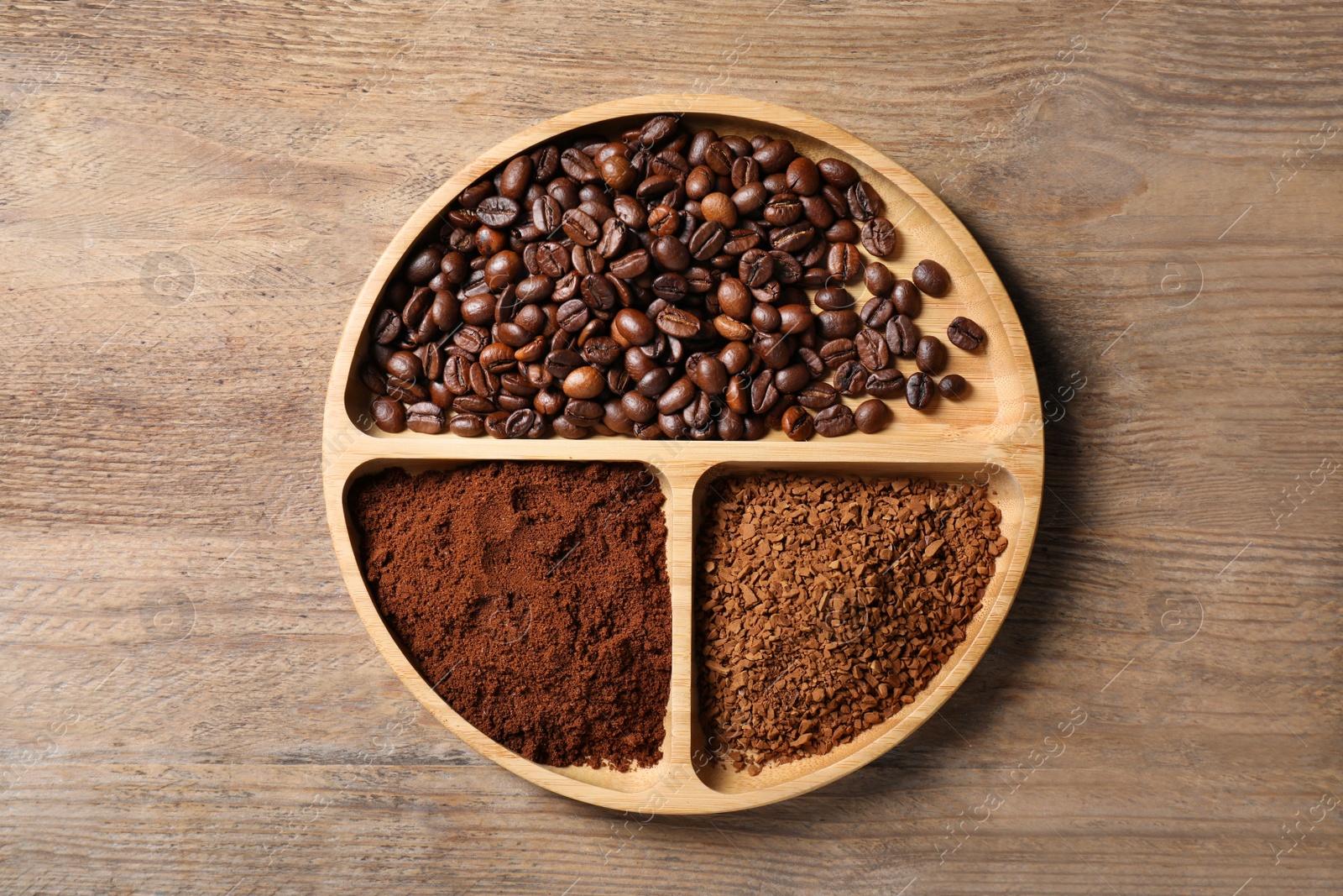 Photo of Instant, ground coffee and roasted beans on wooden table, top view