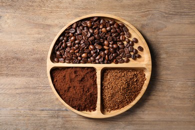 Photo of Instant, ground coffee and roasted beans on wooden table, top view