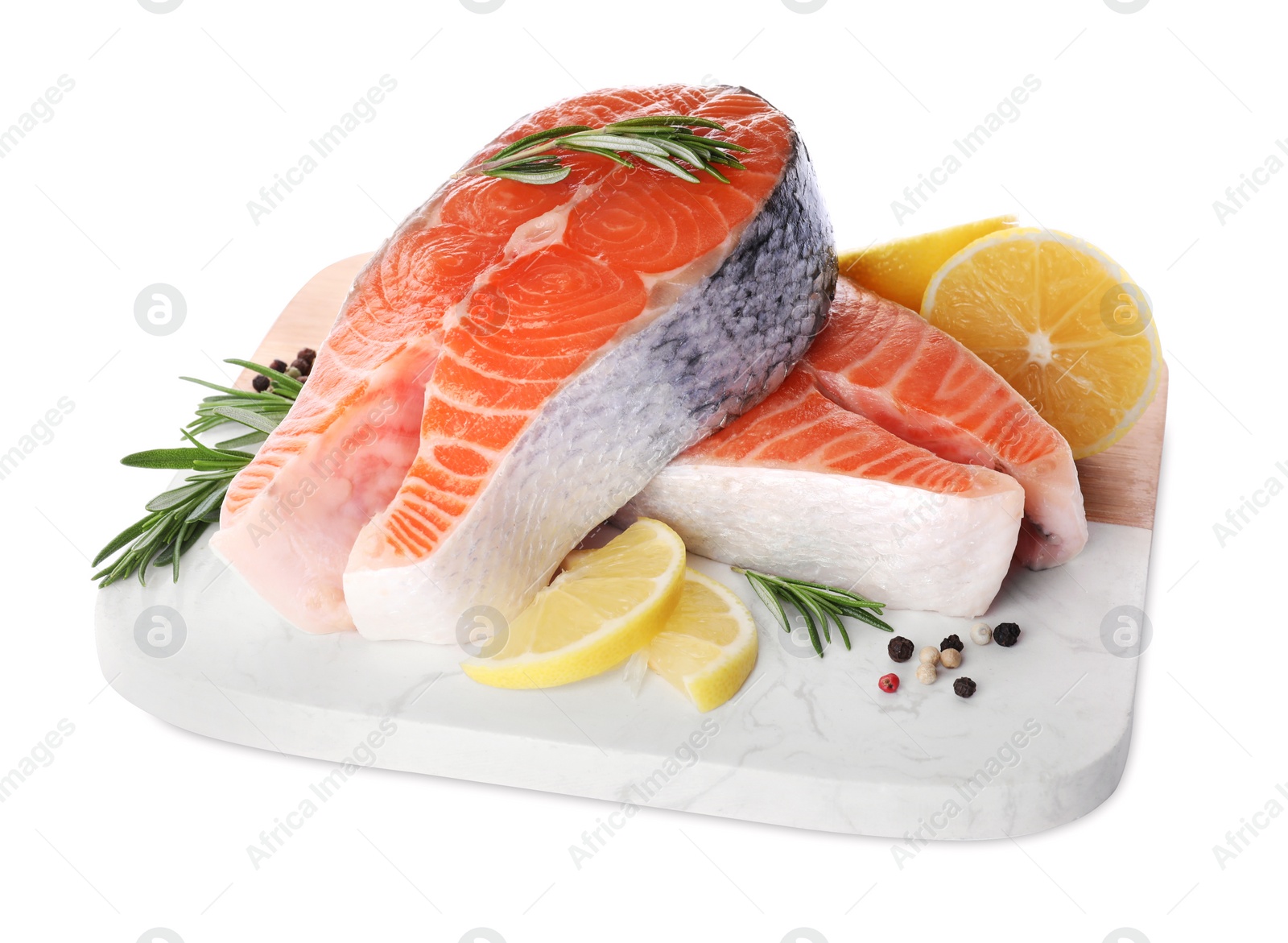 Photo of Fresh raw salmon steaks with rosemary, peppercorns and lemon on white background