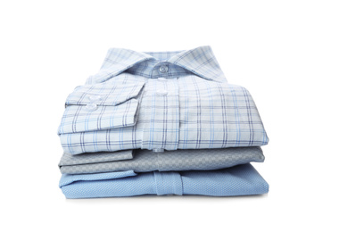 Photo of Stack of stylish male shirts isolated on white