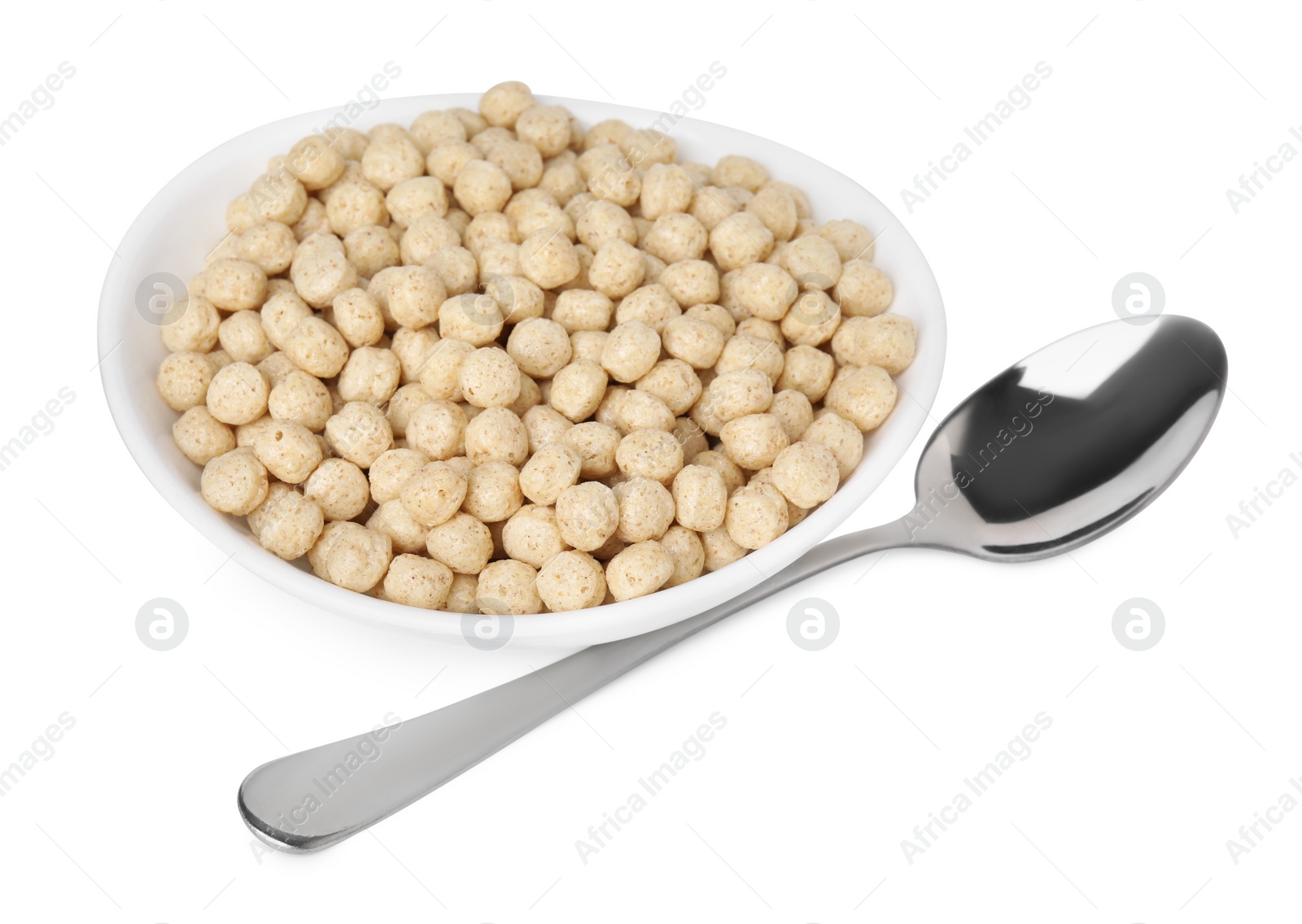 Photo of Tasty sweet cereal balls in bowl and spoon isolated on white