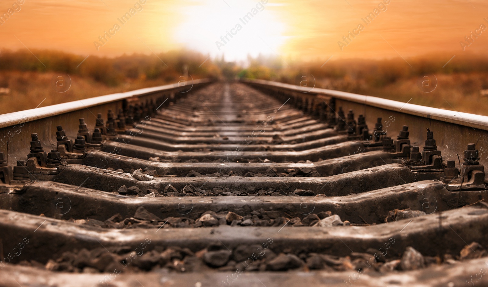 Photo of Railway line in countryside at sunset. Train journey