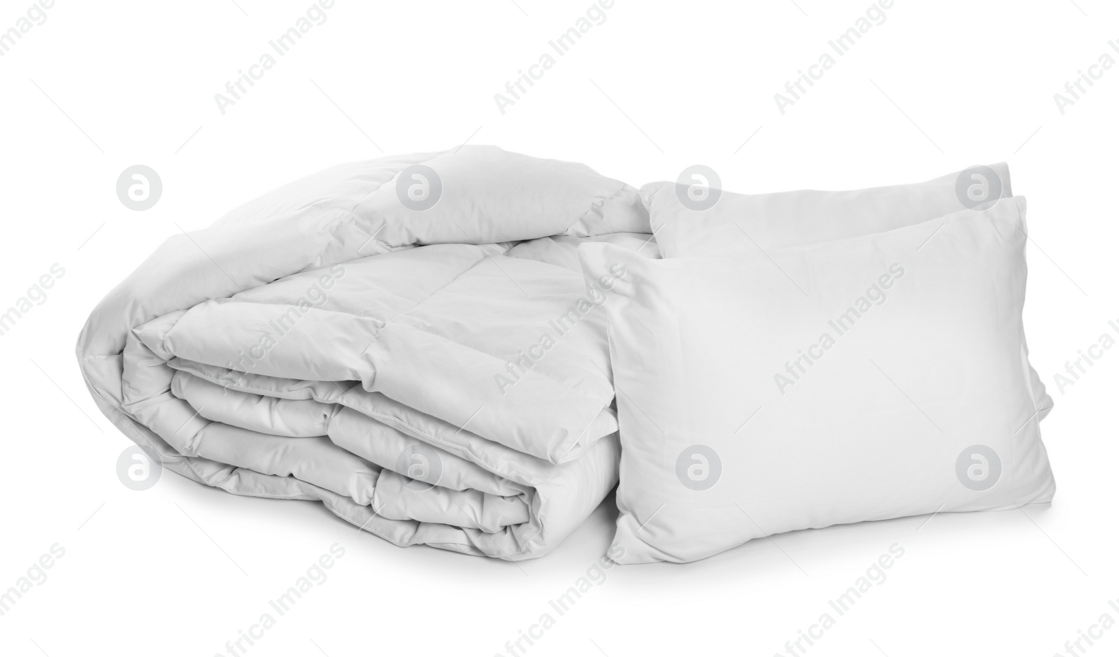 Photo of Clean blanket and pillows on white background