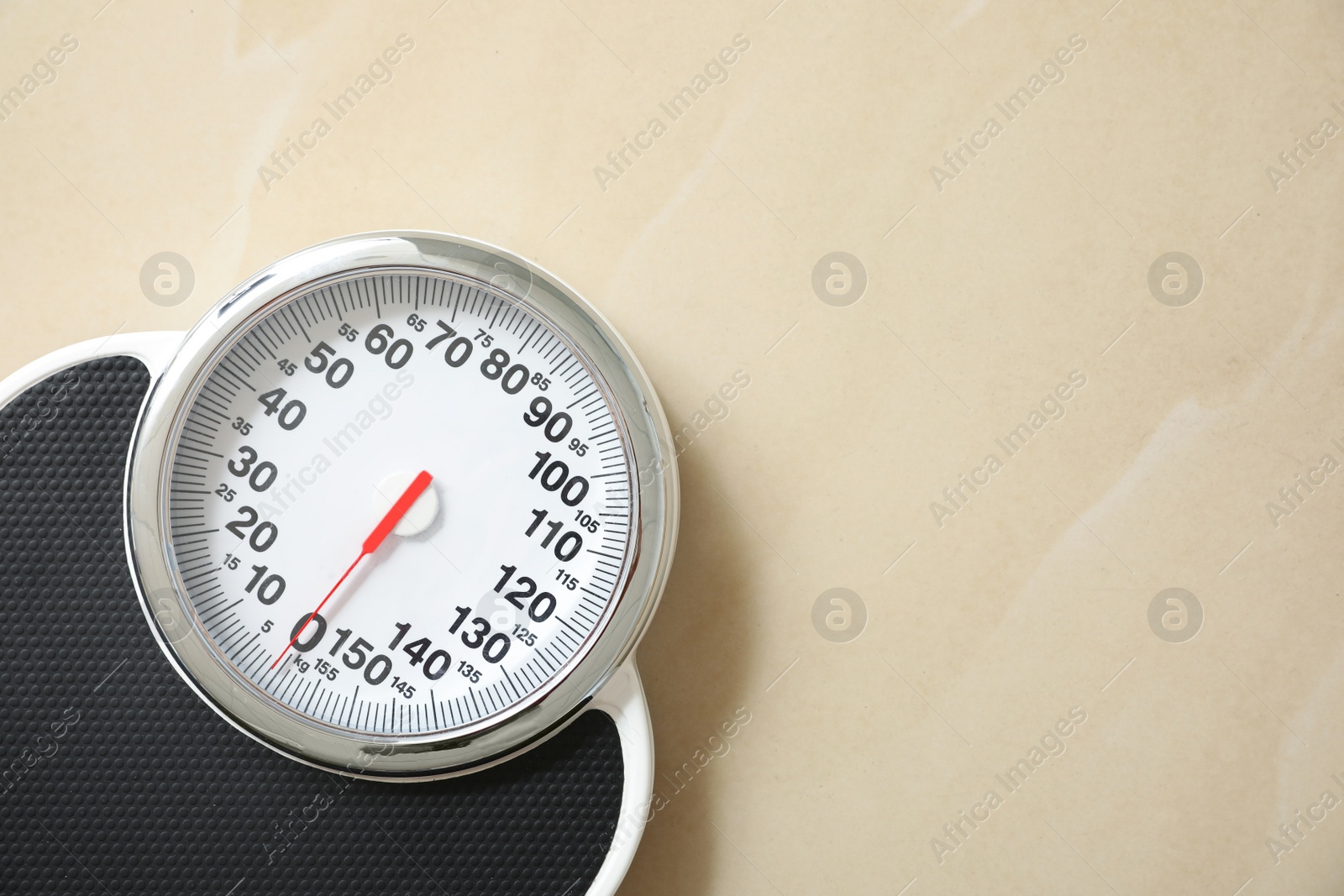 Photo of Top view of scales on floor, space for text. Overweight problem