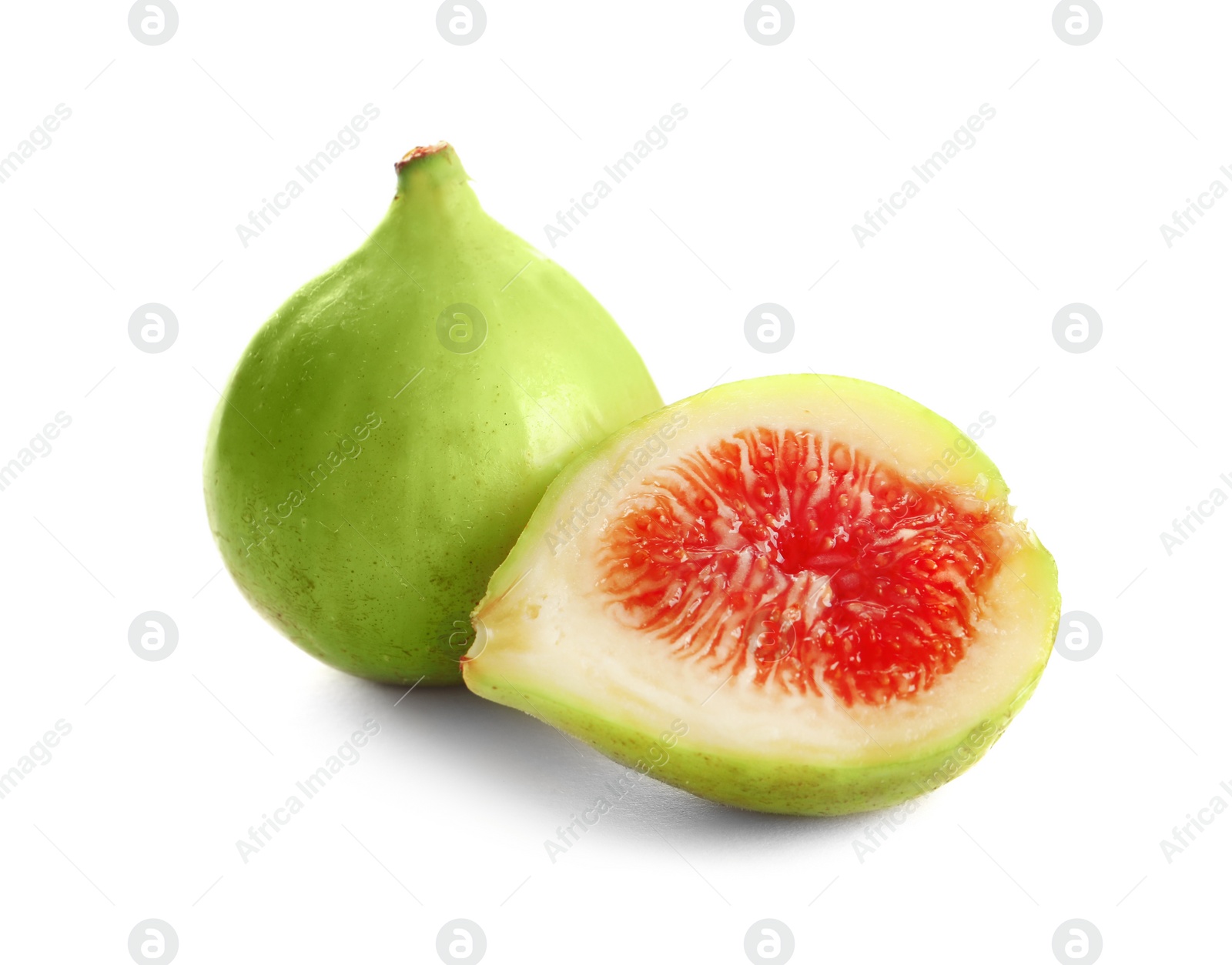 Photo of Whole and cut green figs on white background