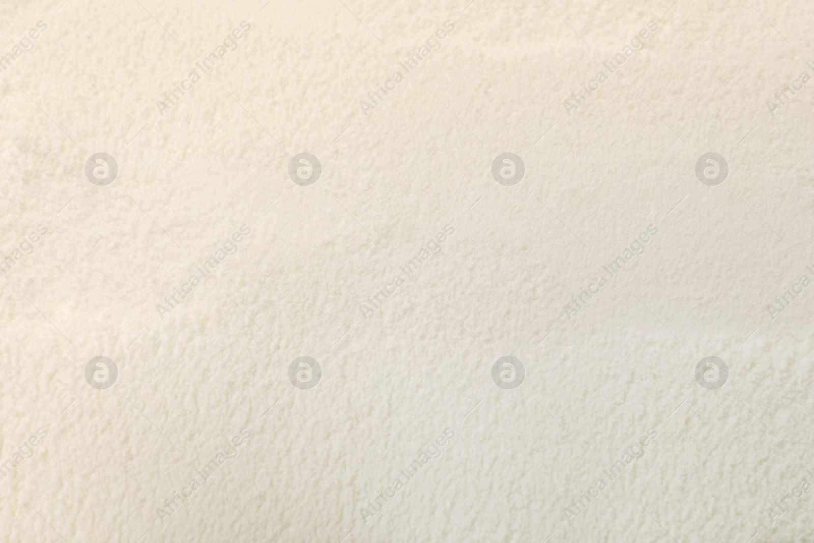 Photo of Closeup view of powdered infant formula as background. Baby milk