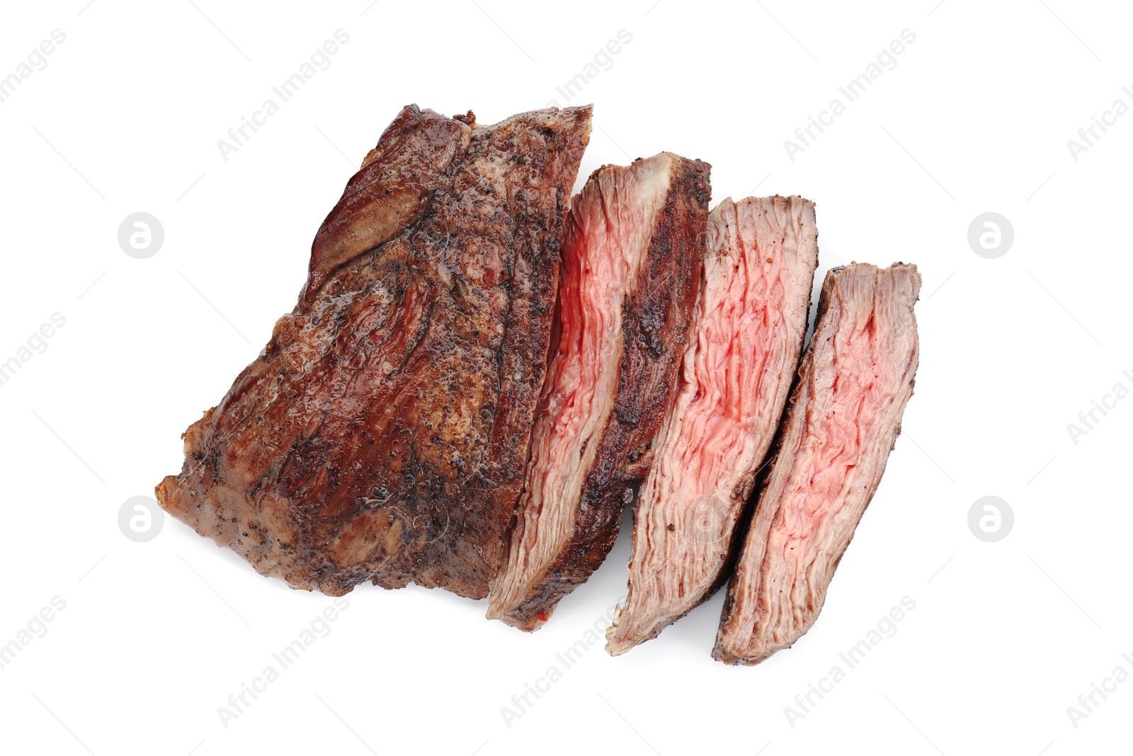 Photo of Pieces of tasty grilled beef meat isolated on white, top view