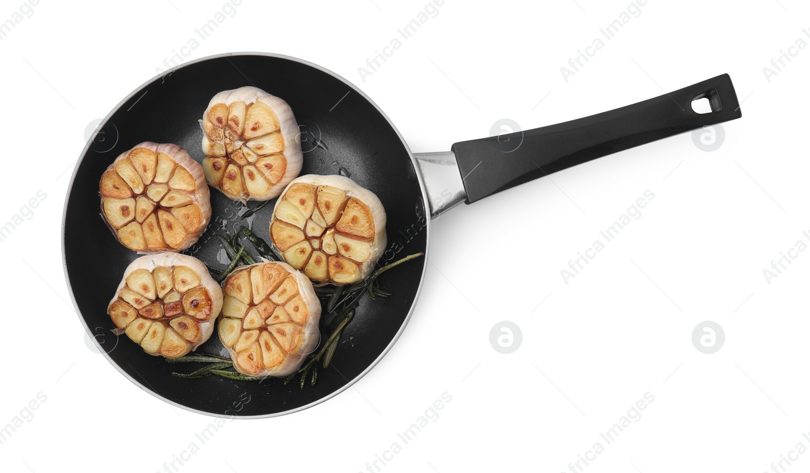 Photo of Frying pan with fried garlic isolated on white, top view