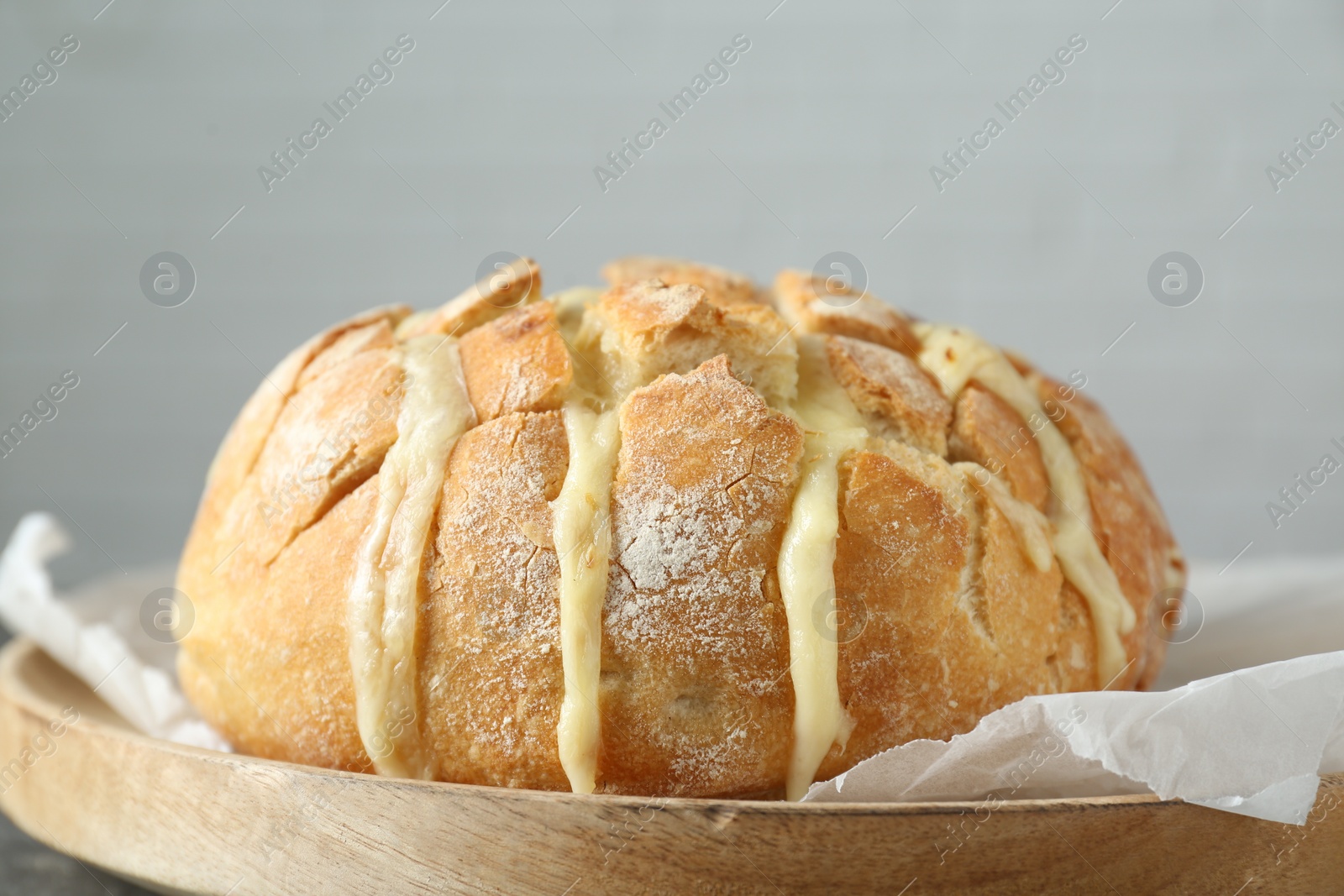Freshly baked bread with tofu cheese on table, closeup Photo of Freshly baked bread with tofu cheese on table, closeup