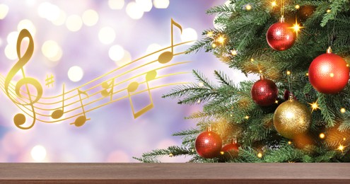 Music notes and table near Christmas tree on blurred background, bokeh effect. Banner design with space for text