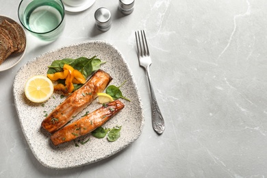 Tasty cooked salmon served for dinner, top view