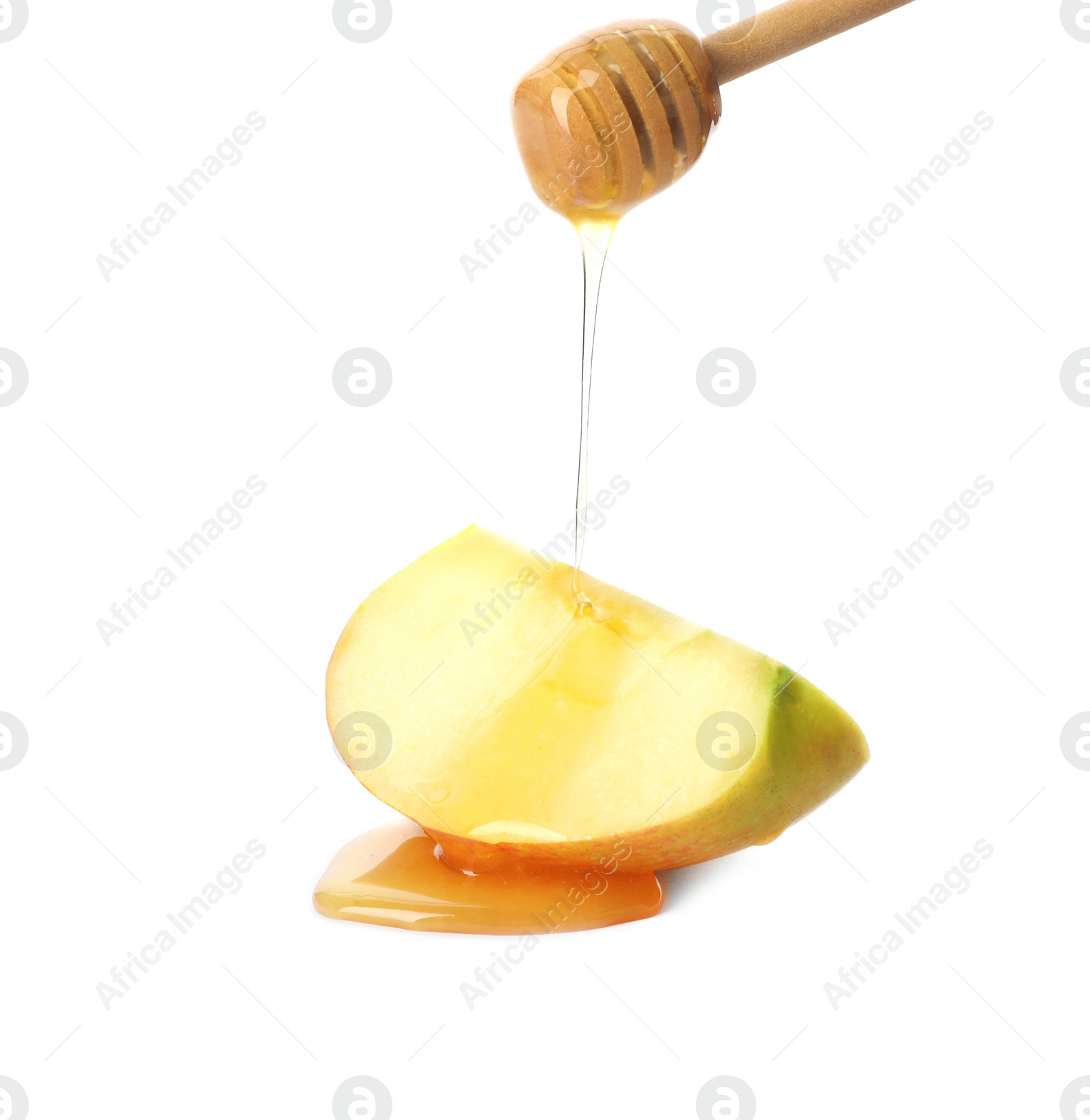 Photo of Pouring sweet honey onto sliced apple on white background