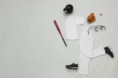 Flat lay composition with baseball uniform on white background