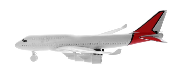 Photo of Toy airplane isolated on white. Travel concept