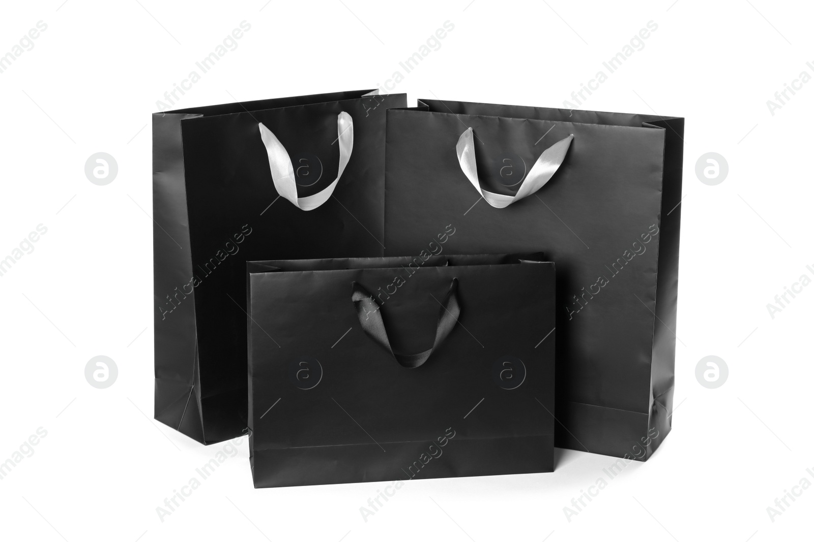 Photo of Paper shopping bags isolated on white. Mock up for design