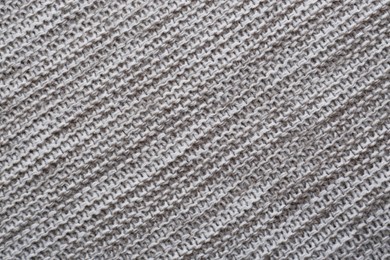 Photo of Beautiful grey knitted fabric as background, top view