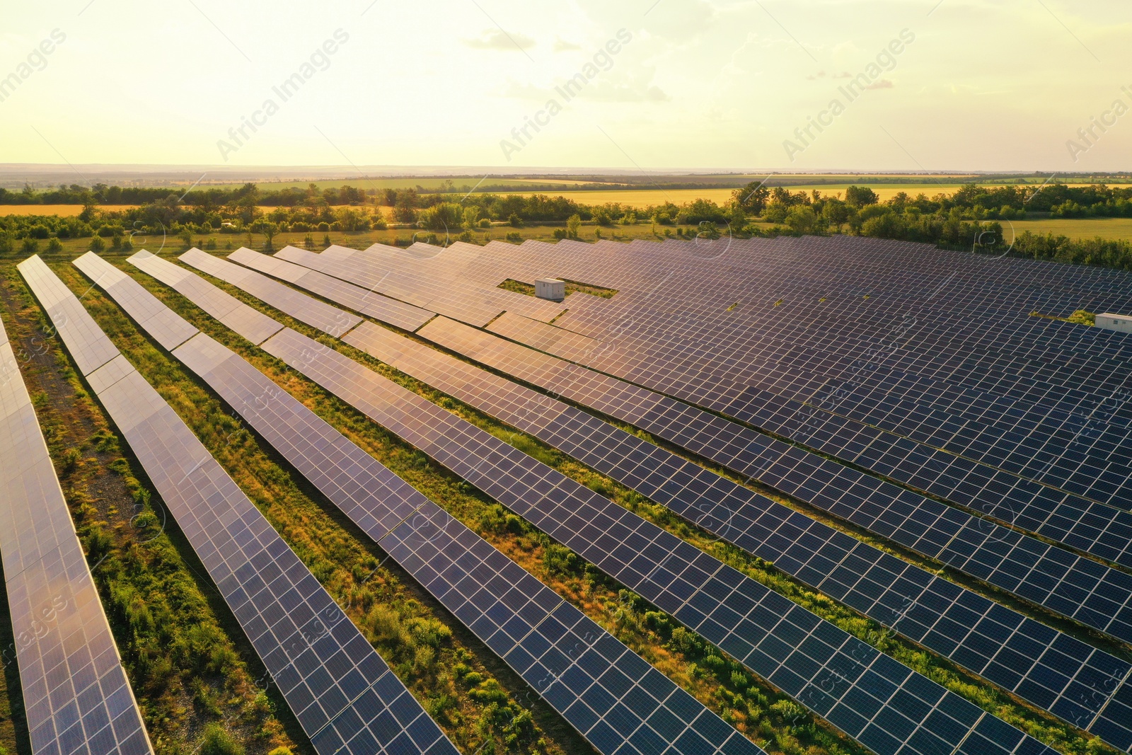 Photo of Solar panels installed outdoors, aerial view. Alternative energy source