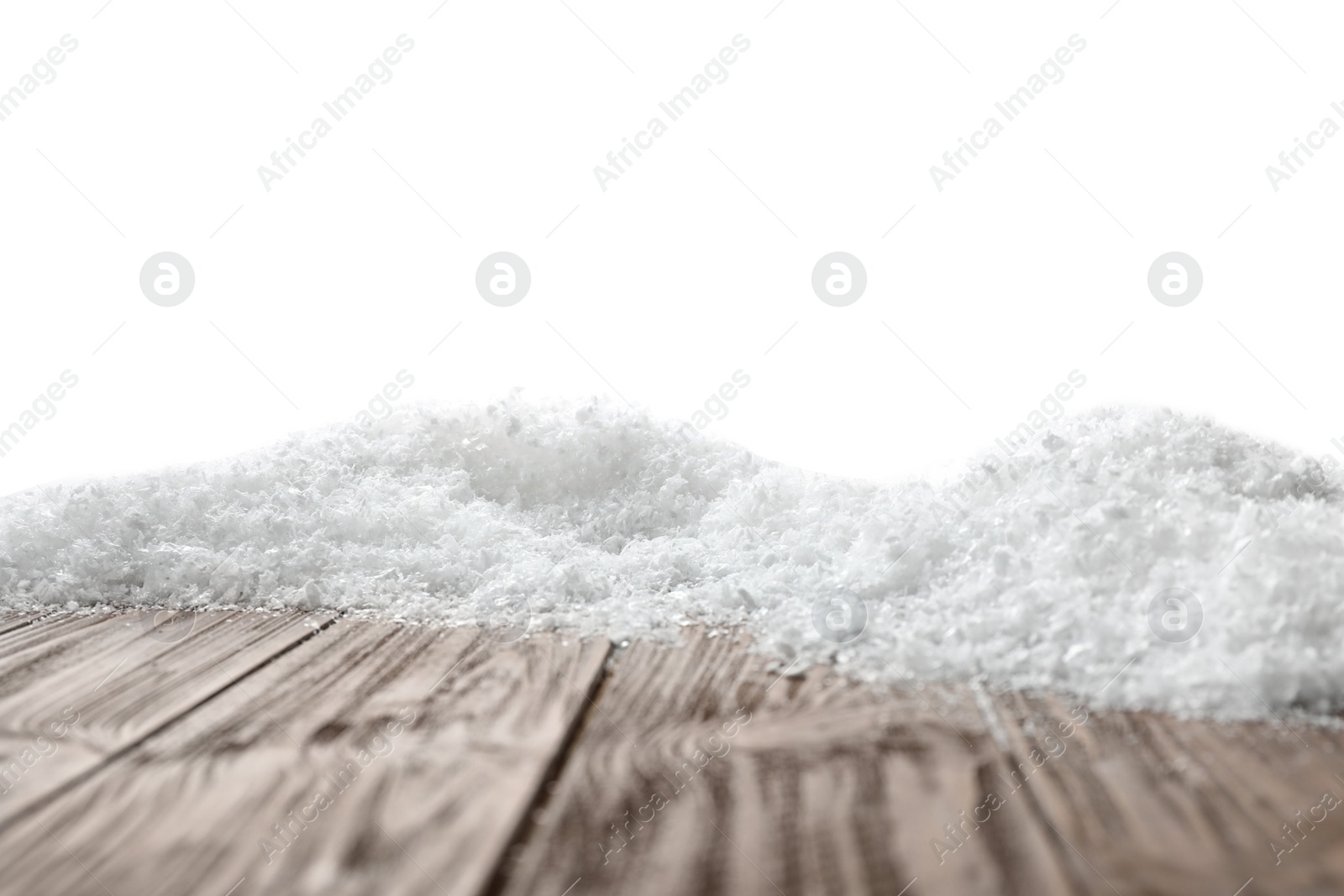 Photo of Wooden surface covered with snow against white background