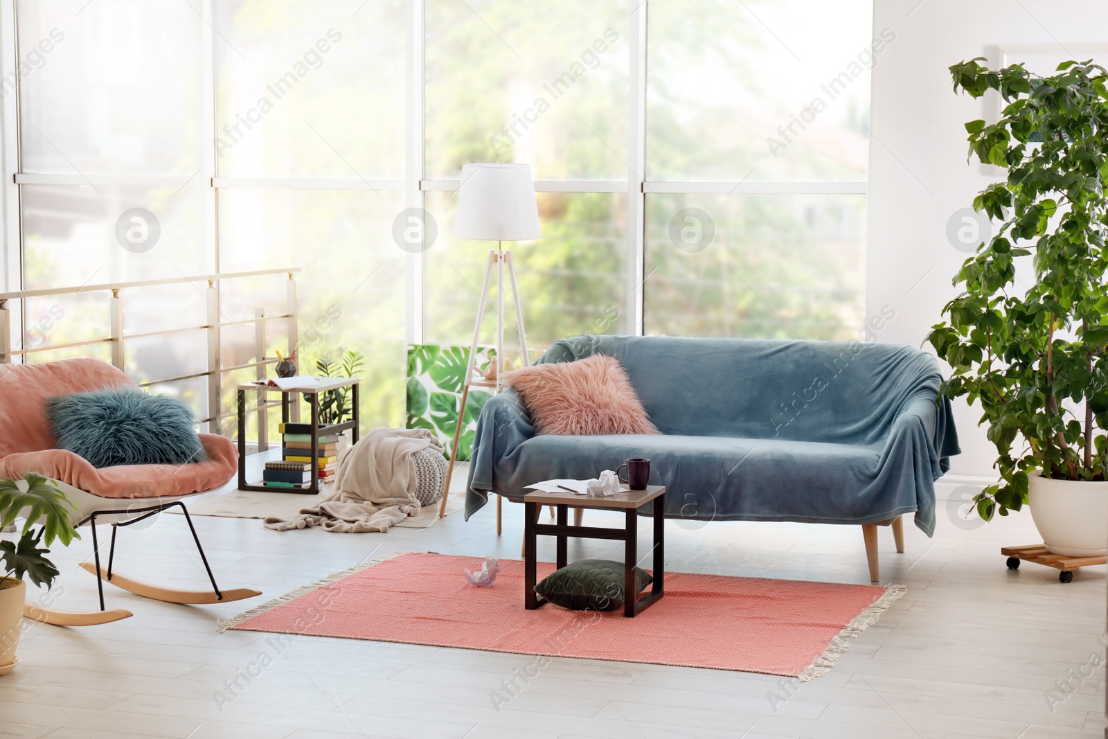 Photo of Elegant living room interior with rocking chair and cozy sofa